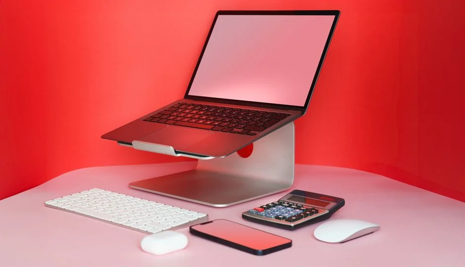 Person shopping online using a laptop and credit card, highlighting e-commerce convenience.
